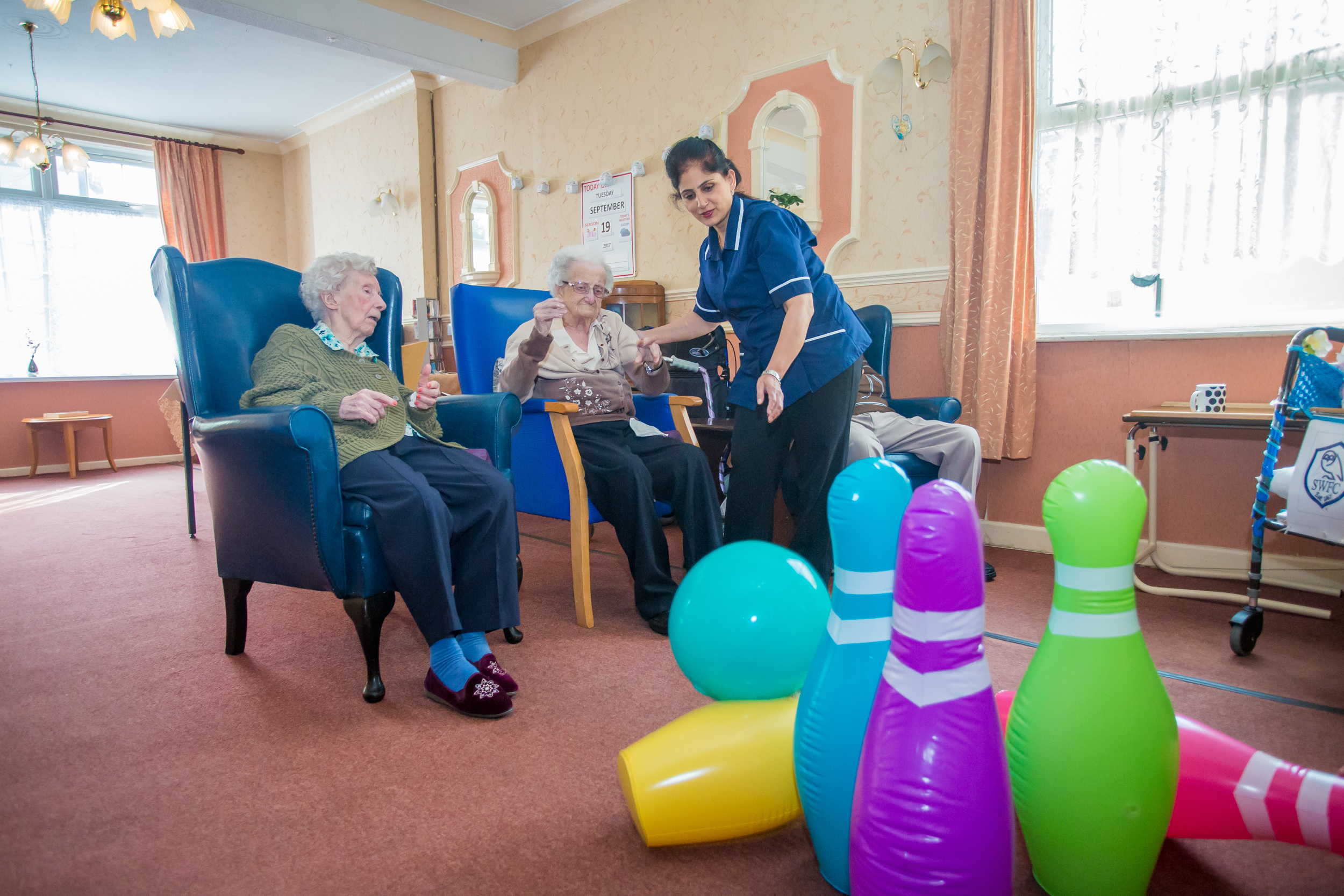 Skittles in the lounge, with residents in the blue chairs